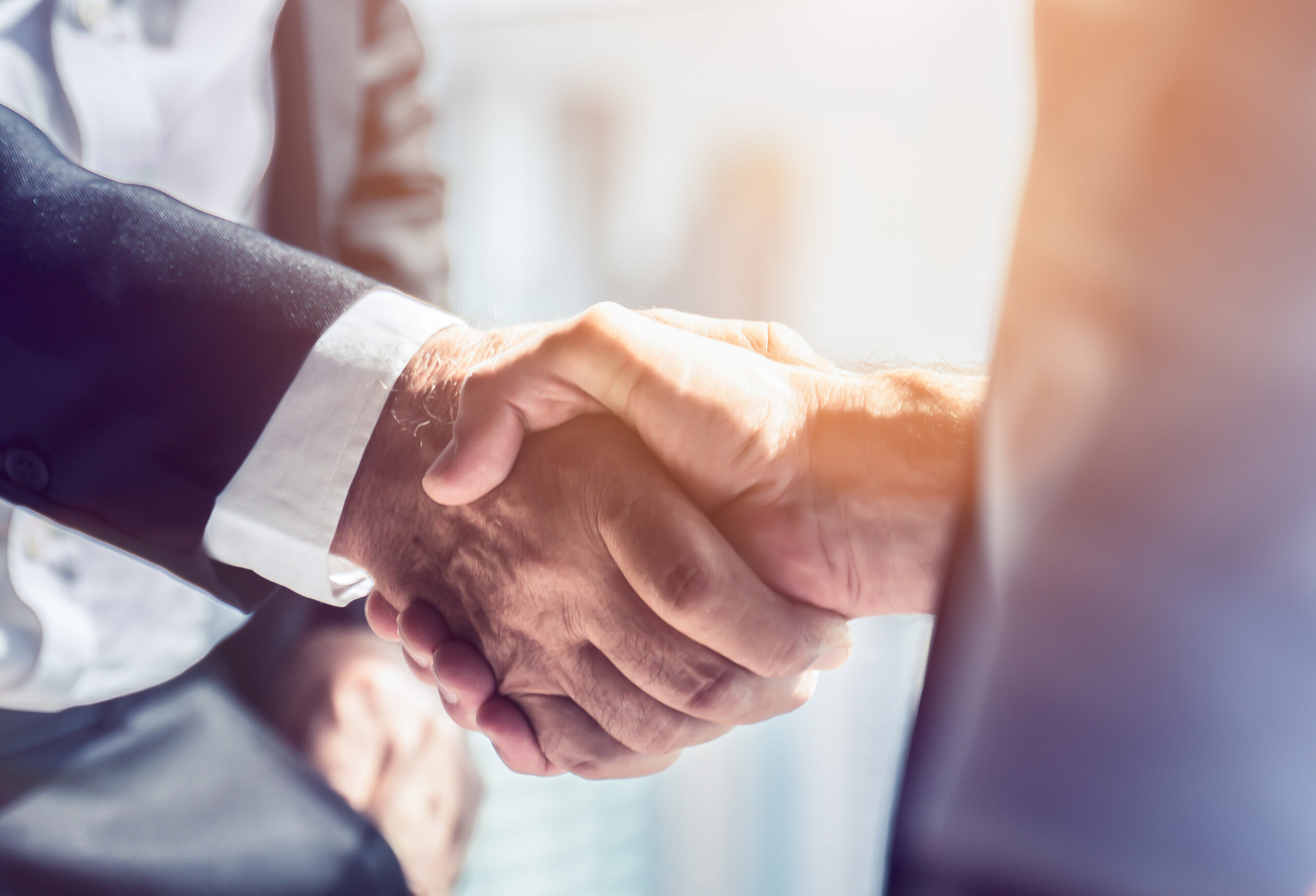 Businessman handshake for teamwork of business merger and acquis